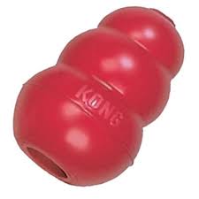 Classic red KONG dog toy made of durable rubber with a hollow center for treat stuffing, designed for chewing and interactive play.