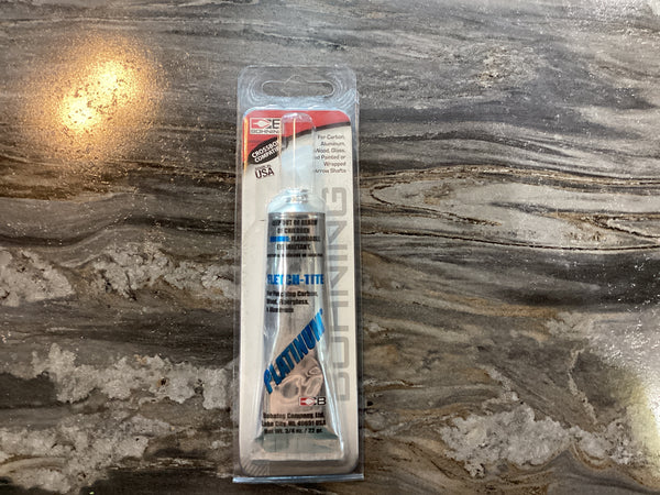 A tube of Boltite aluminum fastener seal in its original retail packaging, placed on a dark, polished marble surface.