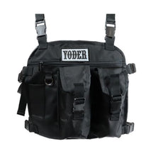 A black Yoder 2 pocket chest pack with adjustable straps and multiple compartments.