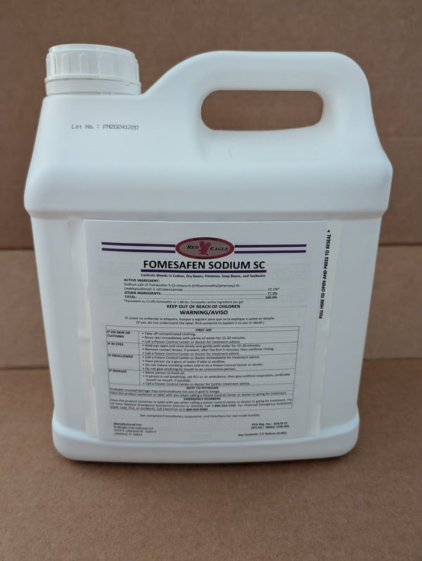 A white plastic jug of Fomesafen Sodium SC fungicide with a handle and a large white label, photographed against a brown cardboard background.