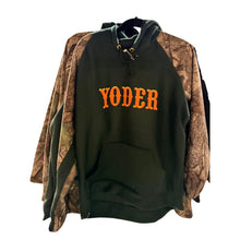 Black hoodie with 'YODER' text on a camouflage jacket background