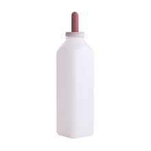 calf bottle with screw on nipple on a white background