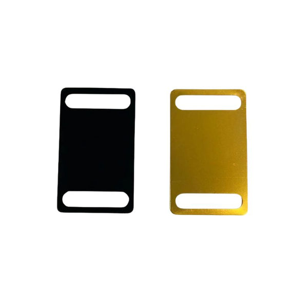 Black and gold gps collar tags on a white background